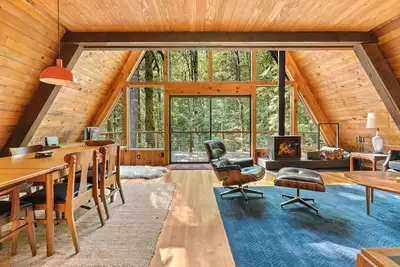 Image de Riverside A-frame in gated cabin community with private deck, woodstove, & W/D