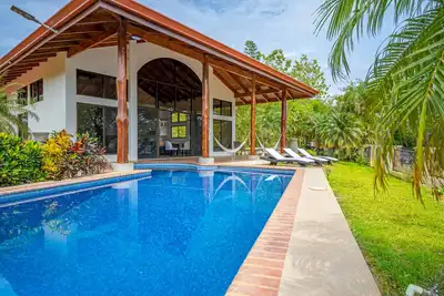 Exclusive tropical retreat with astonishing ocean views, pool, partial Ac, & W/D