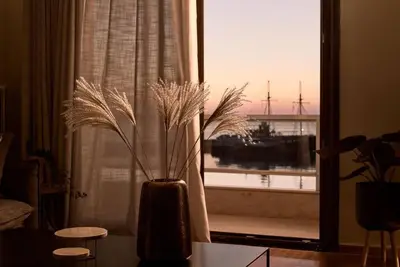 Image de A luxury waterfront apartment with unobstructed views of the sea and harbor.