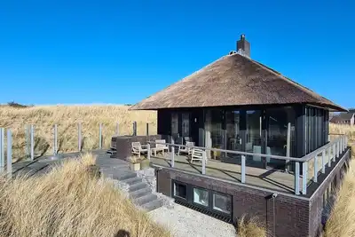 Image de Hestia, a spacious villa in the dunes with jacuzzi and sauna near the village Nes.