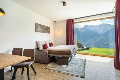 Image de Appartement de vacances \"Paflur Lodges Abendrot\" avec vue sur la montagne, terrasse privée et Wi-Fi