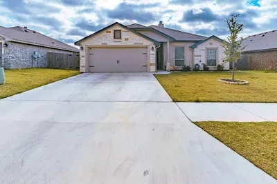 Image de Beautiful 5 bedroom home W/ gym Ev charger & grill