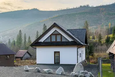 Image de Chalet with 4 bedrooms, living room with home cinema, full kitchen next to creek