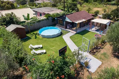 Image de Maison de vacances 'Wooden House Corfu' avec piscine, jardin, terrasse et Wi-Fi