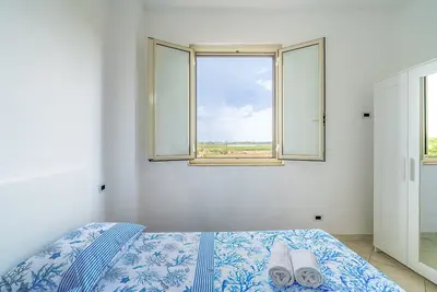 Image de Appartement de vacances \"La Nassa\" avec vue sur la mer, terrasse privée et jardin partagé