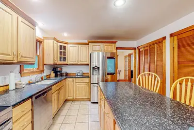 Dog-friendly rural home near beach with firepit, porches, grill, & pellet stove