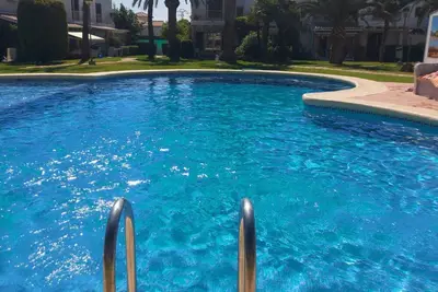 Image de charming little house in a garden with pool