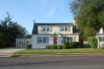 Walk to the beach from this charming Bay Head beach house that sleeps a crowd.