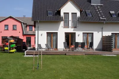 Image de SÜNN & Bries directly on the beach: large house with fenced garden+kayaks+Dsl