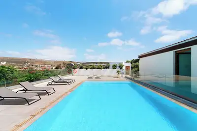 Image de Maison de vacances 'Musa - Finca La Suerte Grande' avec vue montagne et terrasse privée