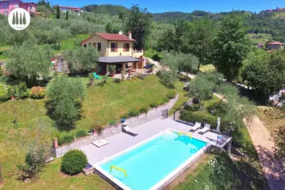 Image de The vacation home is nestled in the Tuscan countryside with a private pool