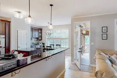 Image de Spacious home with a covered deck, hot tub, firepit, grill, playroom, W\/D, & Ac