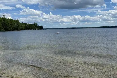 Image de Beautiful private beach area within steps from the modern updated log home