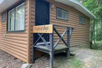 Image de Rustic cabins in secluded campground with lake access and woods to wander in.
