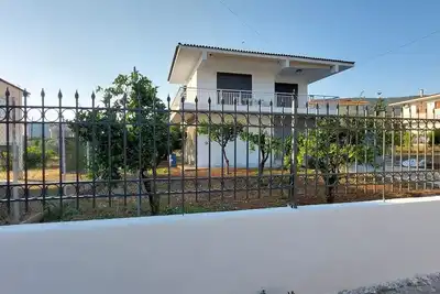 Elegant summer residence with big balcony and garden. Can host 8-10 adults.