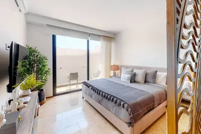 Centro studio with rooftop pool, hot tub, gym, on-site bar, & balcony