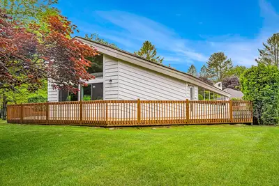 Image de Outdoor retreat with pool, hot tub, and athletic court access - water views