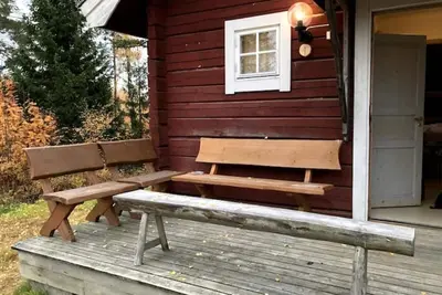 Image de Log cabin. Ramsjö Camping. Ångevägen 24. Timber log nearby river stream