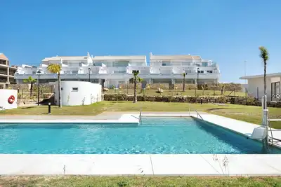 Image de Appartement 'Bajo Poniente' avec vue sur la mer, piscine partagée et Wi-Fi