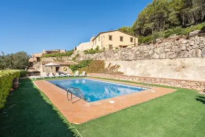 Image de Ferme 'Masia Puigadoll' avec vue sur la montagne, Wi-Fi et climatisation