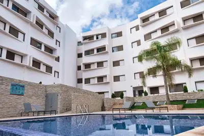 Image de Appartement Luxueux avec 2 Piscines, Wi-Fi illimité, près de la plage