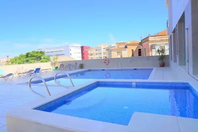 Image de Top Floor Apartment #Ac #Heating #Fast WiFi #Heated Pool #Gym #Spa #Garage