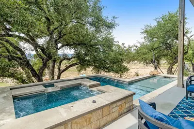Image de Modern charmer with gleaming lake views, pool, fireplace, & grill - dog-friendly