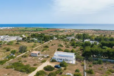 Image de LiAMA Detached villa surrounded by greenery with panoramic sea views.