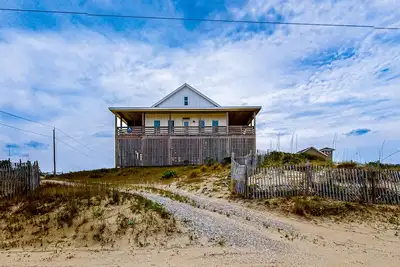Image de Ocean-view home with wrap-around deck, beach access, outdoor shower & cornhole
