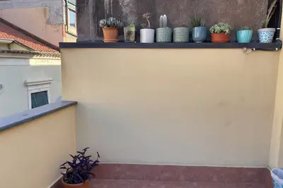 Cozy 2-bedroom house downtown Acitrezza with a picturesque rooftop patio.