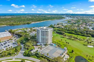 Image de Golf fairway and green view from living room with intracoastal marina next door