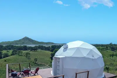 Image de Luxurious Dome set on hillside with views to a lagoon, the ocean and mountains