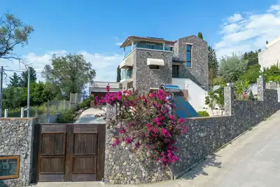 Villa Nera: Luxurious seaview retreat in Corfu's Kefalomandouko Hill.