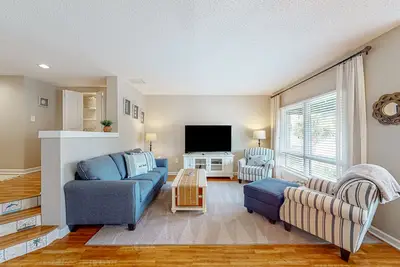 Inviting condo with water view, covered balcony, on-site pool