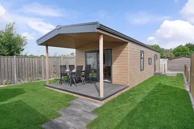 Image de Brand new chalet with veranda, lots of comfort and spacious garden.