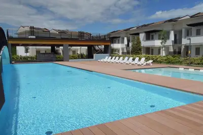 Appartement de vacances avec climatisation, jardin et piscine
