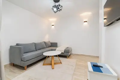 Stylish, Modern Apartment with Workspace Near Top Amenities & 24/7 Security