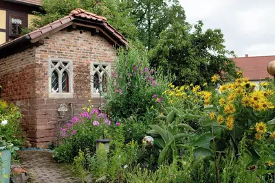 Image de Maison de vacances \"Ferienwohnung-Cottage Rhöner Kräuterwerk\" avec terrasse privée et Wi-Fi