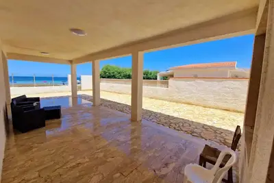 House kissed by the sea