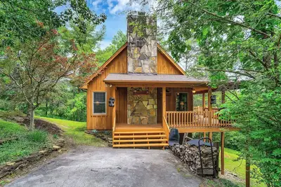 Enjoy this cozy home with a wrap around porch, near the Smoky Mountains