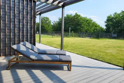 Image de Maison de vacances 'Ferienhaus Schlossterrassen 4b' avec vue sur le lac, terrasse privée et Wi-Fi