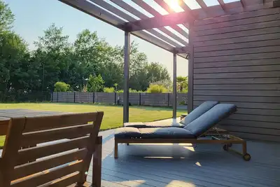 Image de Maison de vacances 'Ferienhaus Schlossterrassen 4a' avec vue sur le lac, terrasse privée et Wi-Fi