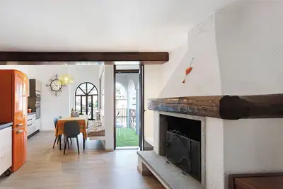 Image de Appartement 'Mansarda Vialba' dans une maison de vacances avec vue sur le lac et balcons