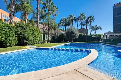 Image de Appartement 'Ático Dúplex Dénia' avec vue sur la mer, piscine partagée et climatisation