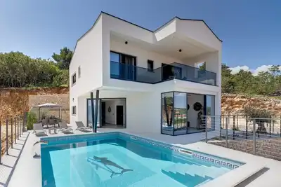 Image de Maison de vacances Vrbnik pour 1 - 6 personnes avec 3 chambres à coucher - Maison mitoyenne