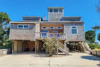 Take in the Obx from the panoramic views offered by this 4 Br oceanside home!