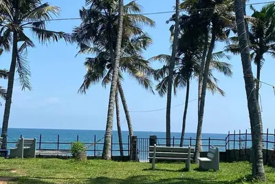 Cliff beach chalet with private beach access near Varkala. \n