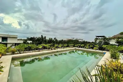 Image de Charming 1-Bedroom Condo with Private Patio and Pool for Rent in Aldea Zama