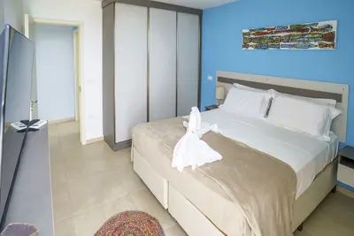 Image de Apart. Hotel. Com Praia a Menos de um Minuto do Apartamento, Rede, Piscina