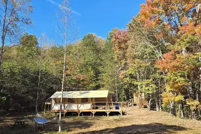 Image de Charming meadow camp in the forest  mountains near fish pond. Events are Ok. Pet